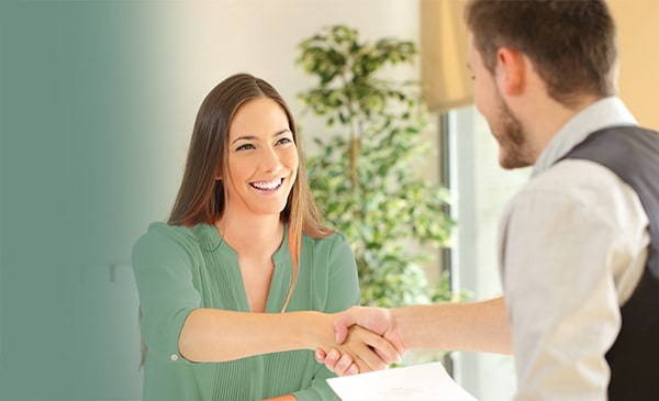 Woman shaking a mans hand | Finance Manager